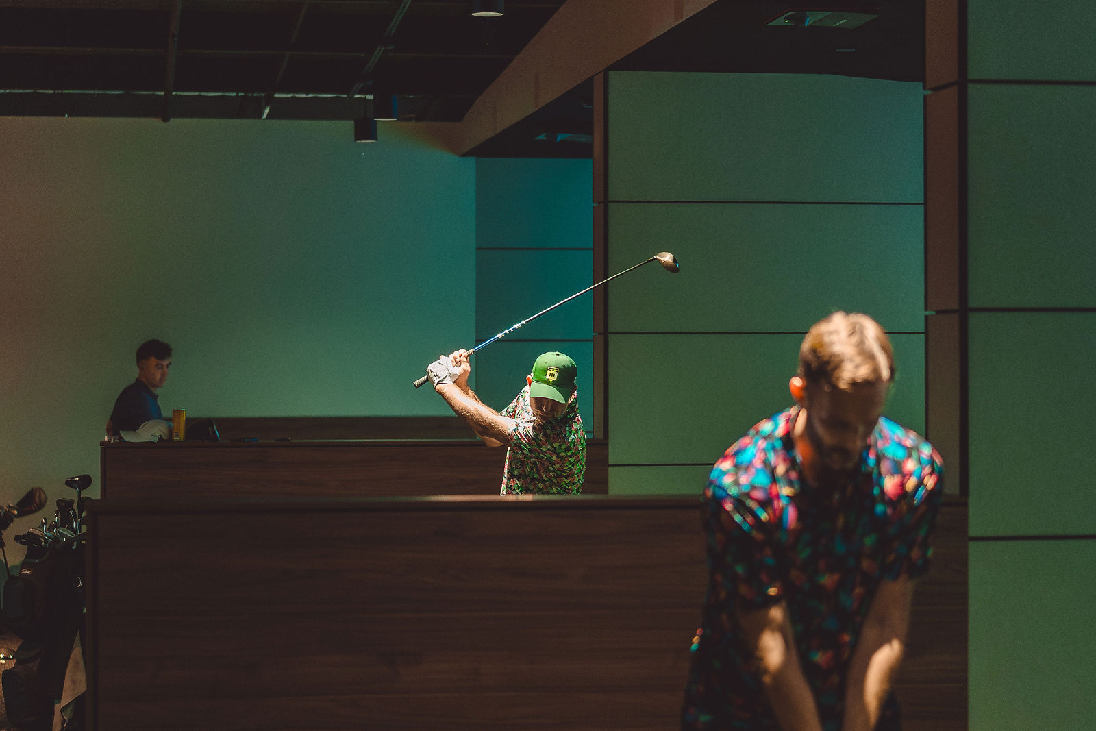 Players teeing off across neighbouring bays